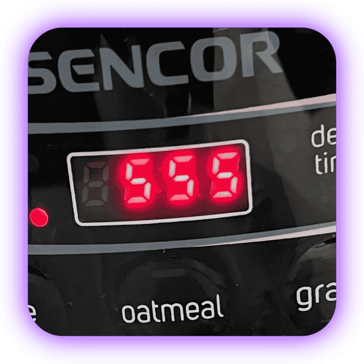 Sencor rice cooker with the number 555 on its digital display.